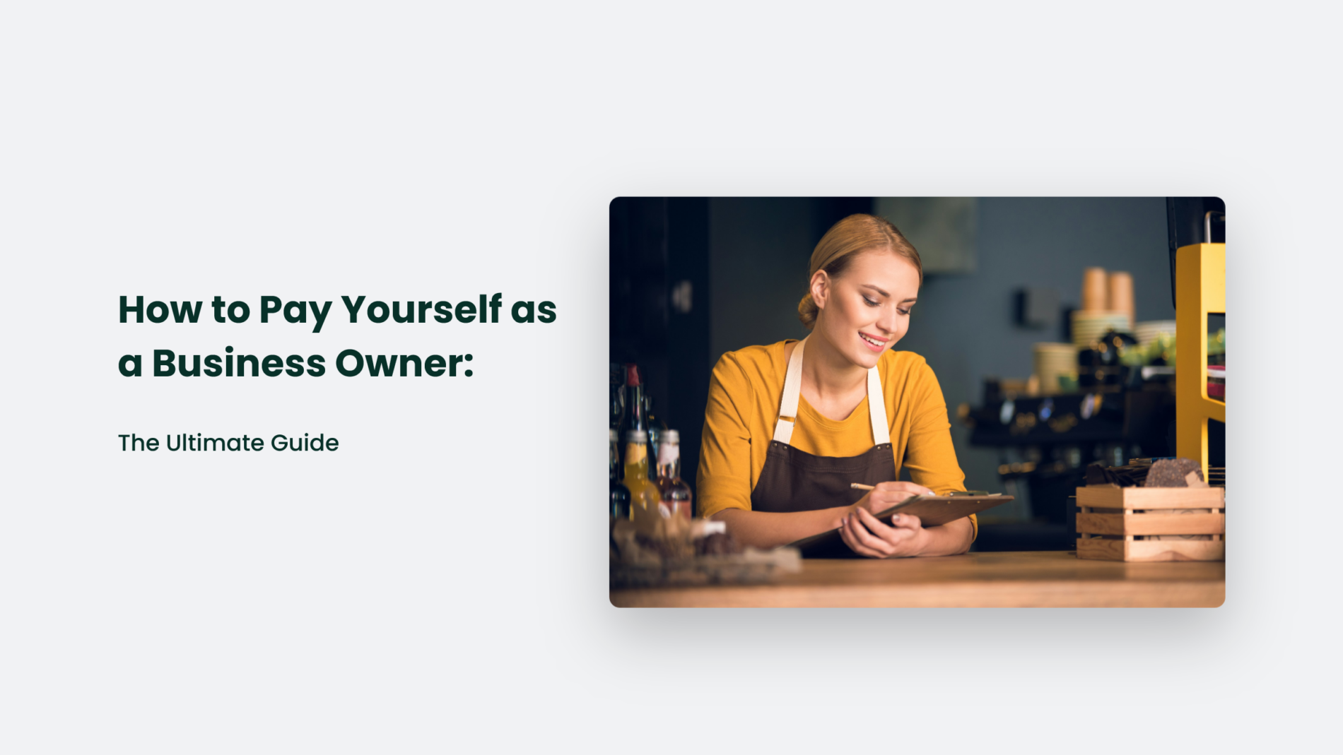 A business owner in an apron efficiently navigates the bustling cafe counter while using a tablet. On the left, bold text reads, "How to Pay Yourself as a Business Owner: The Ultimate Guide.