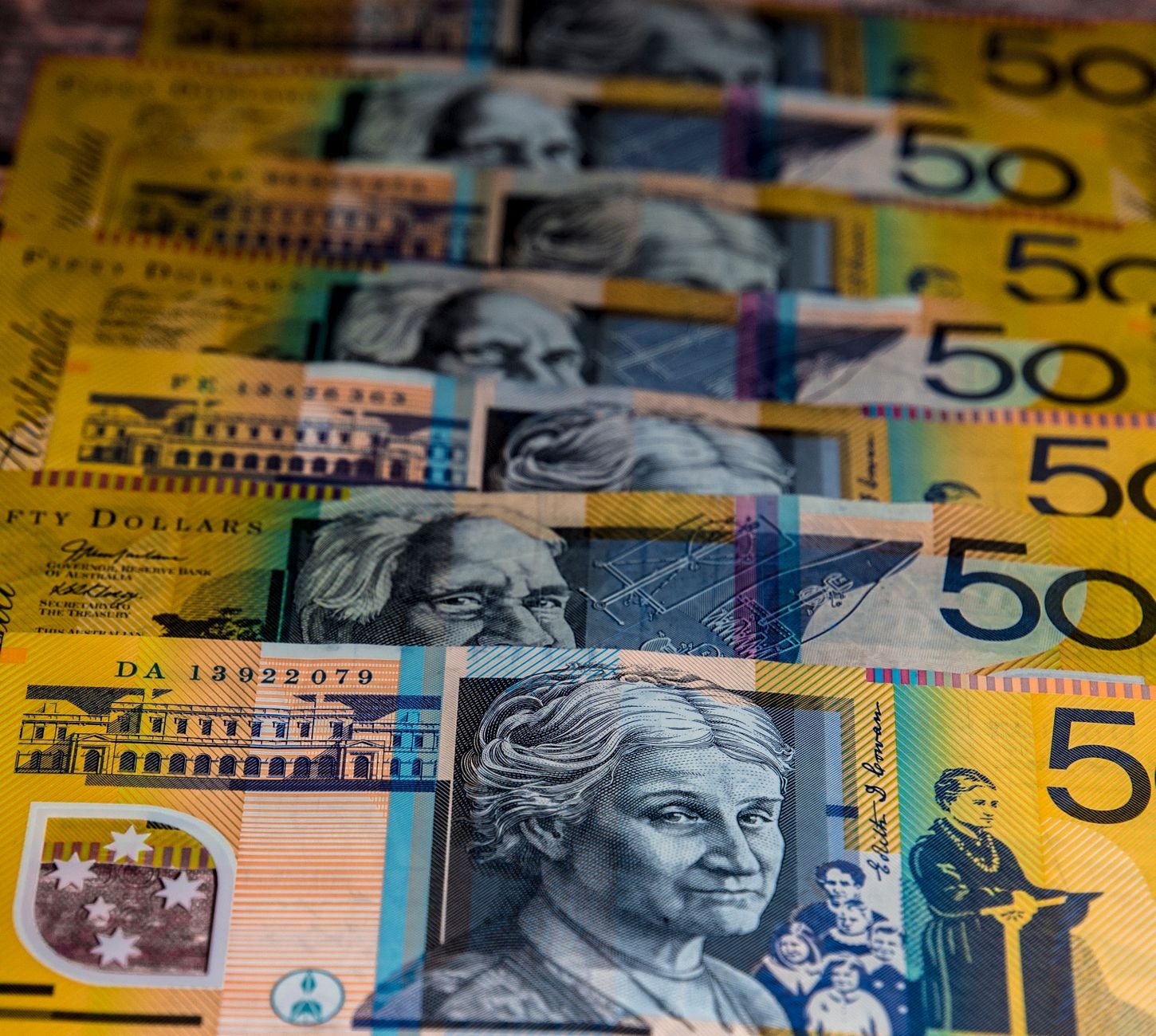 Fanned Australian $50 banknotes, illustrating wages and superannuation paid together under Australia's payday super rules